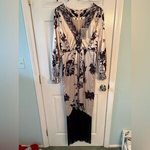 Elegant Black and Cream Floral Maxi Dress with fringe bottom.